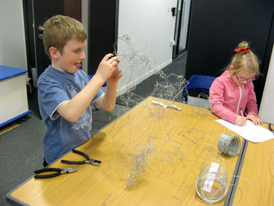Working hard creating wire sculptures!